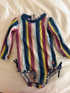 Ruffle Butts Navy and Multicolor Striped Long Sleeve One-Piece